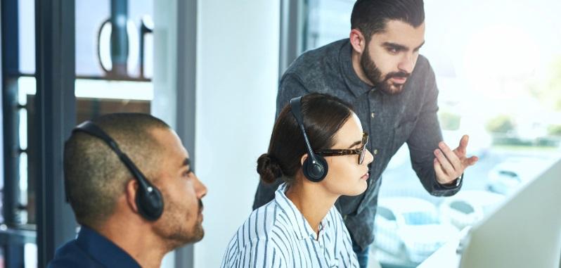 Businessman_assisting_his_colleagues_in_a_call_centre